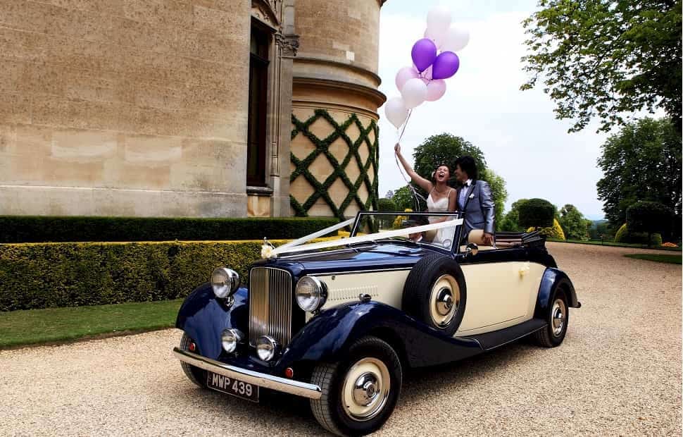 Jaguar Royale Drophead convertible with the bride and groom at Waddesdon Manor