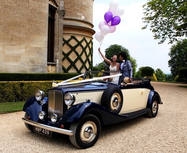 Jaguar drophead convertible with the Bride and Groom